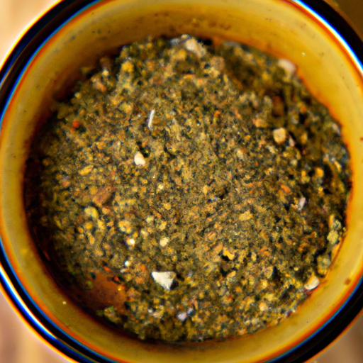 A close-up of homemade Cajun seasoning mix in a small bowl